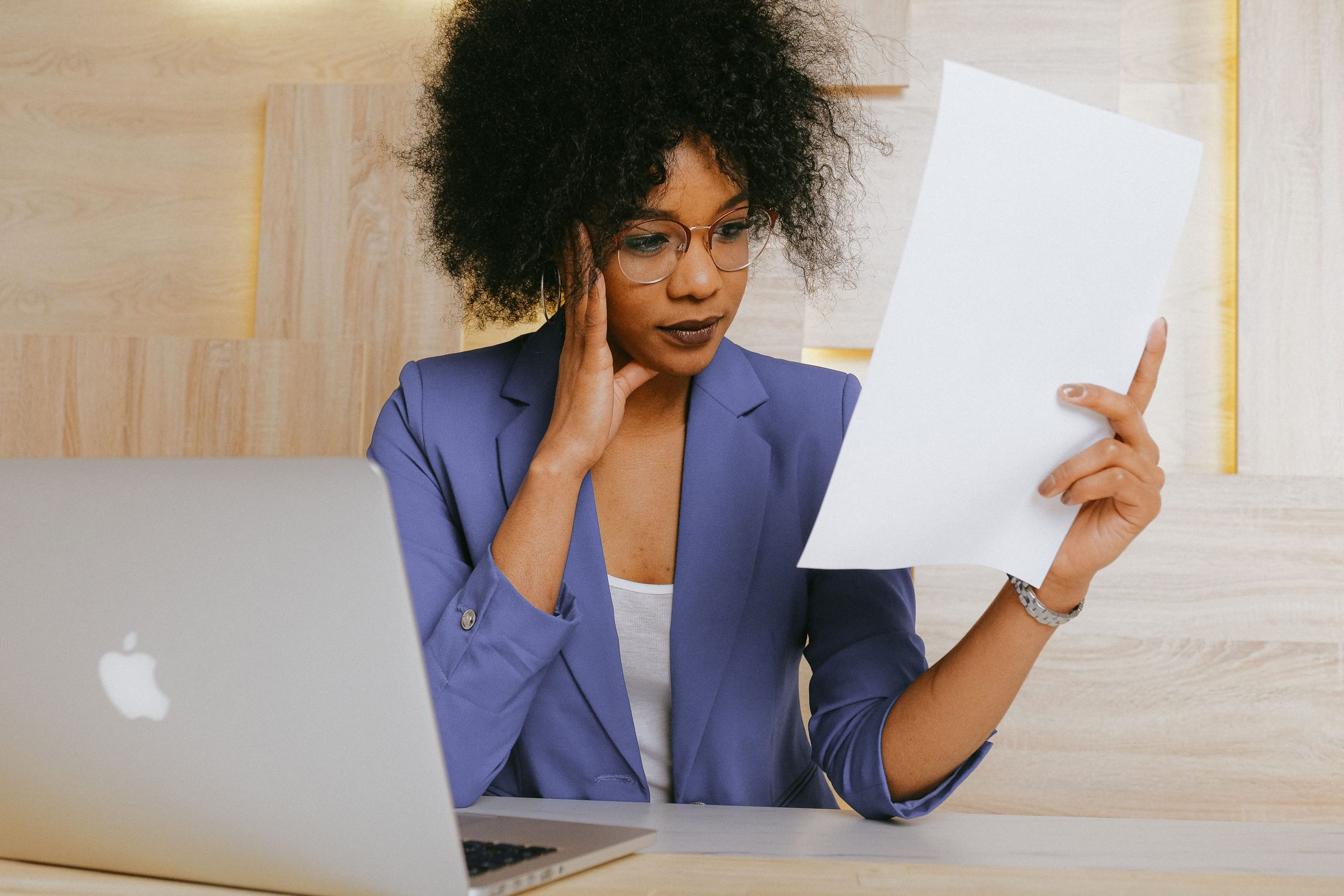 Consultant reviewing project documents at a desk